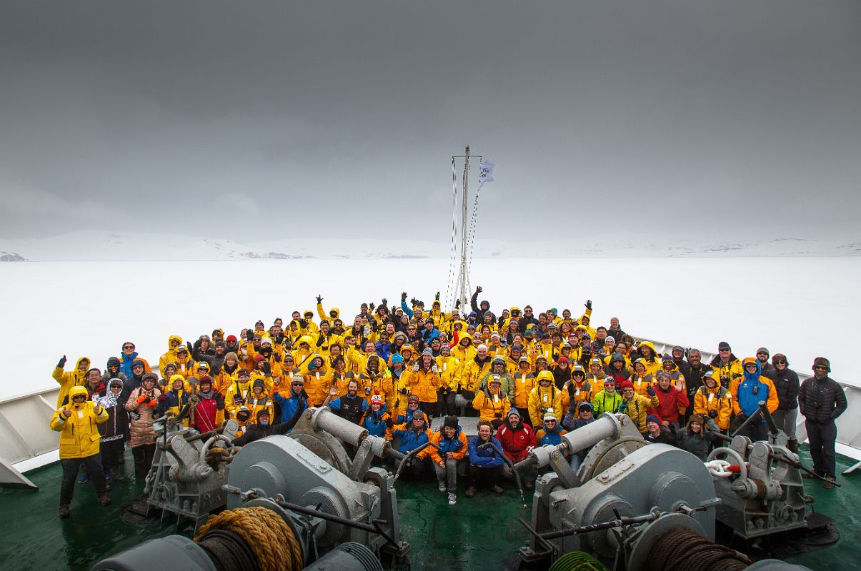 07C Tourists And Expedition Members Pose At The Front Of The Quark Expeditions Antarctica Cruise Ship At Deception Island